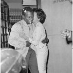 miles-davis-is-kissed-by-his-wife-as-he-is-released-from-jail-in-1959-photograph-stanley-hall-bettmanncorbis